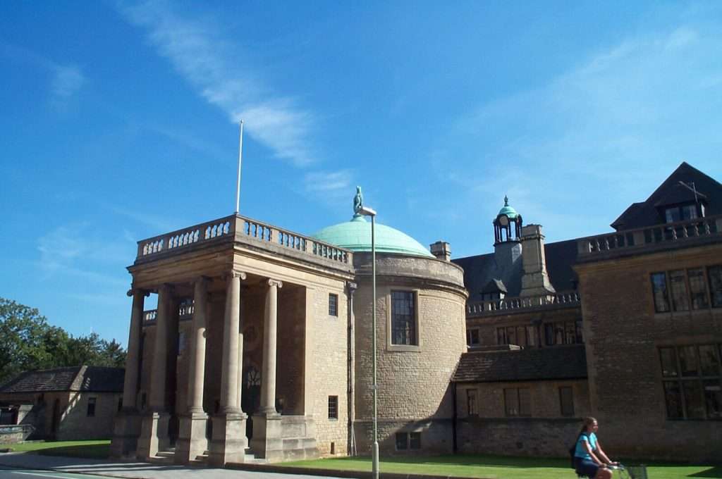 A columned building with a domed, green roof is featured at Oxford.
