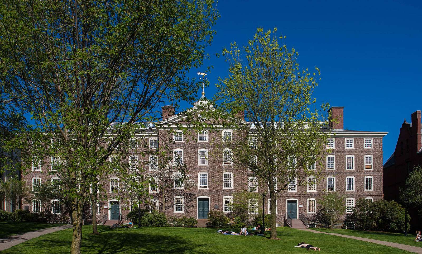 Students lounge outside University Hall at Brown University.