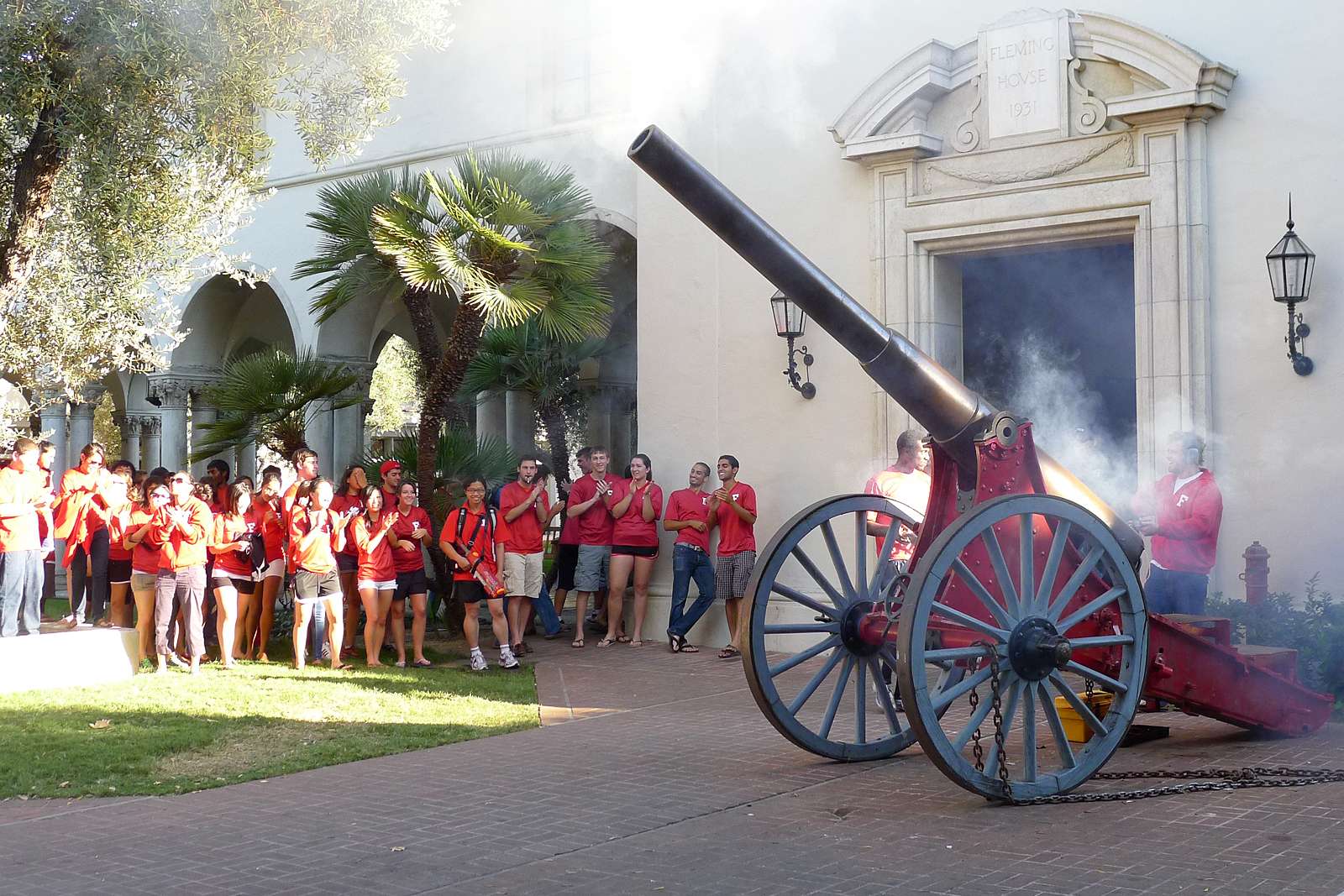 Students in red shirts surround the Fleming Cannon at Caltech.