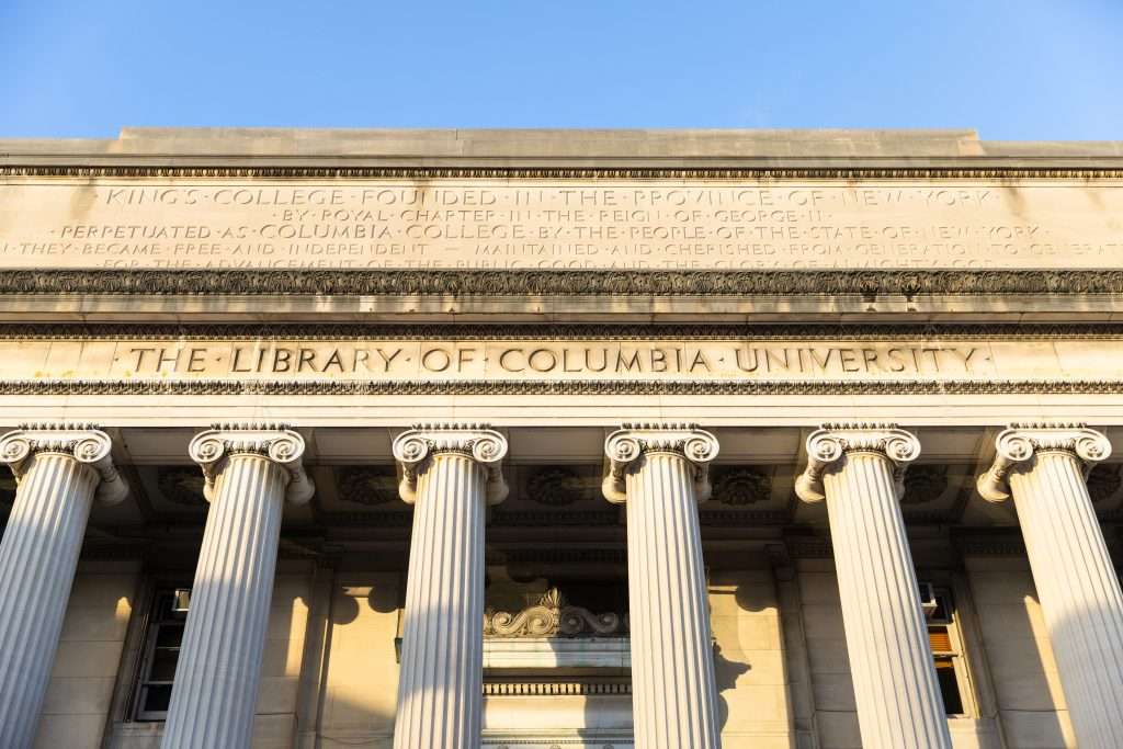 Lettering denoting "The Library of Columbia University" is featured atop columns at Columbia.