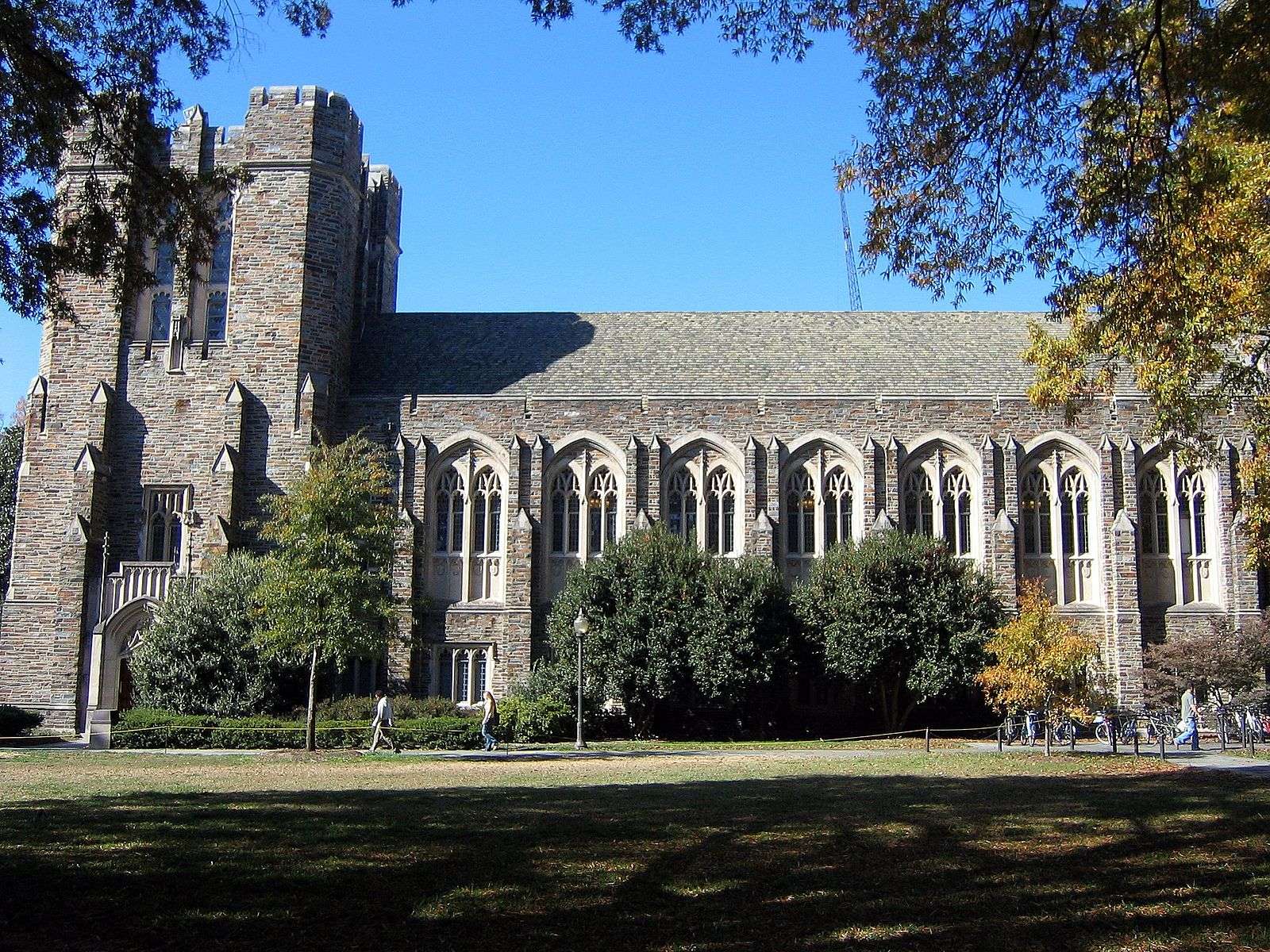 A side shot of the Duke Chapel is cast in shadow.