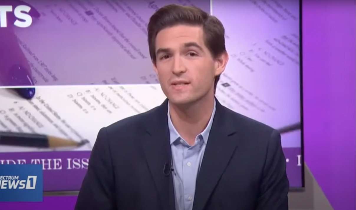 This is a screenshot of Ivy Coach's Jayson Weingarten appearing on Spectrum News 1 in front of a purple background.