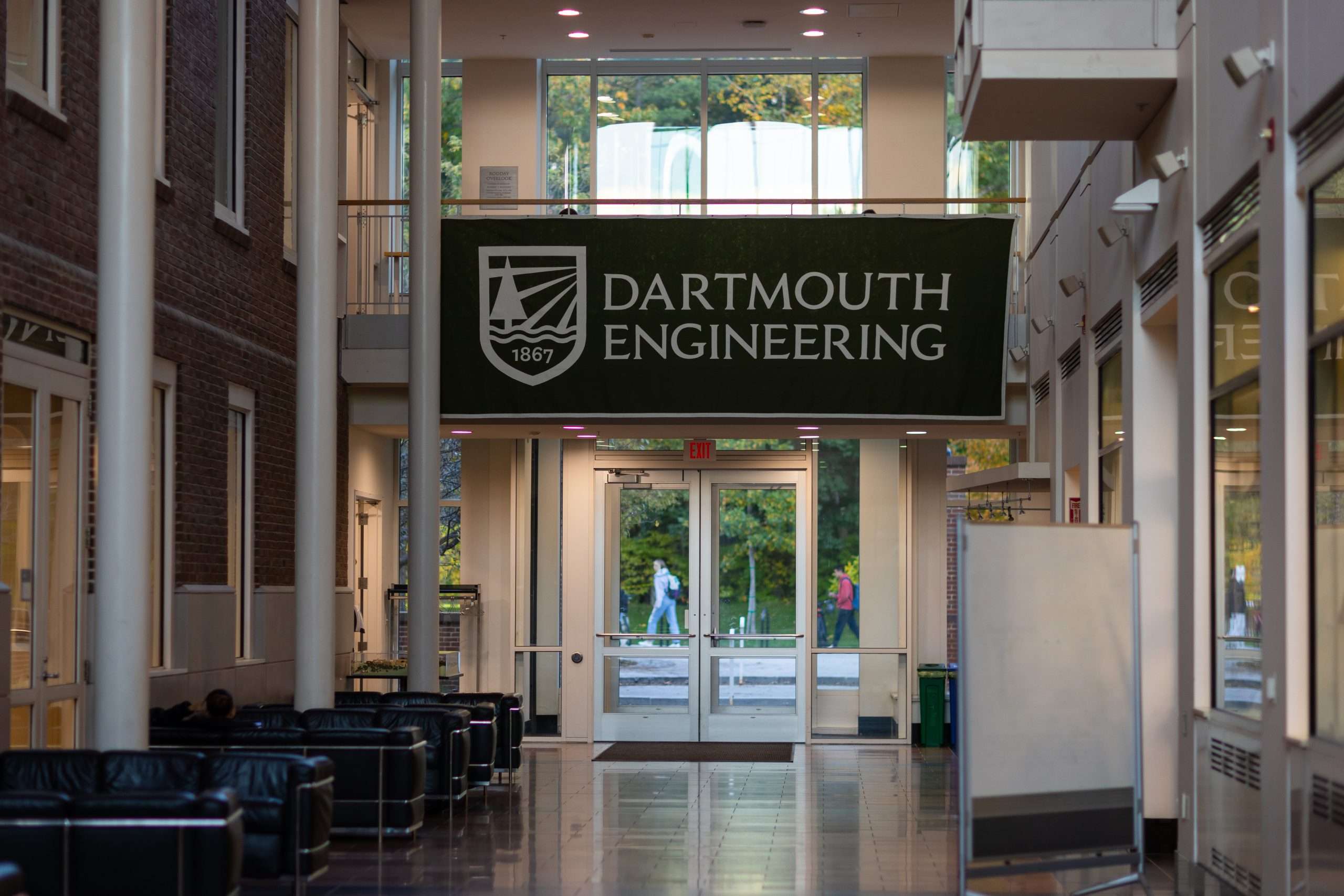 A Dartmouth Engineering green banner hangs inside an engineering building at Dartmouth