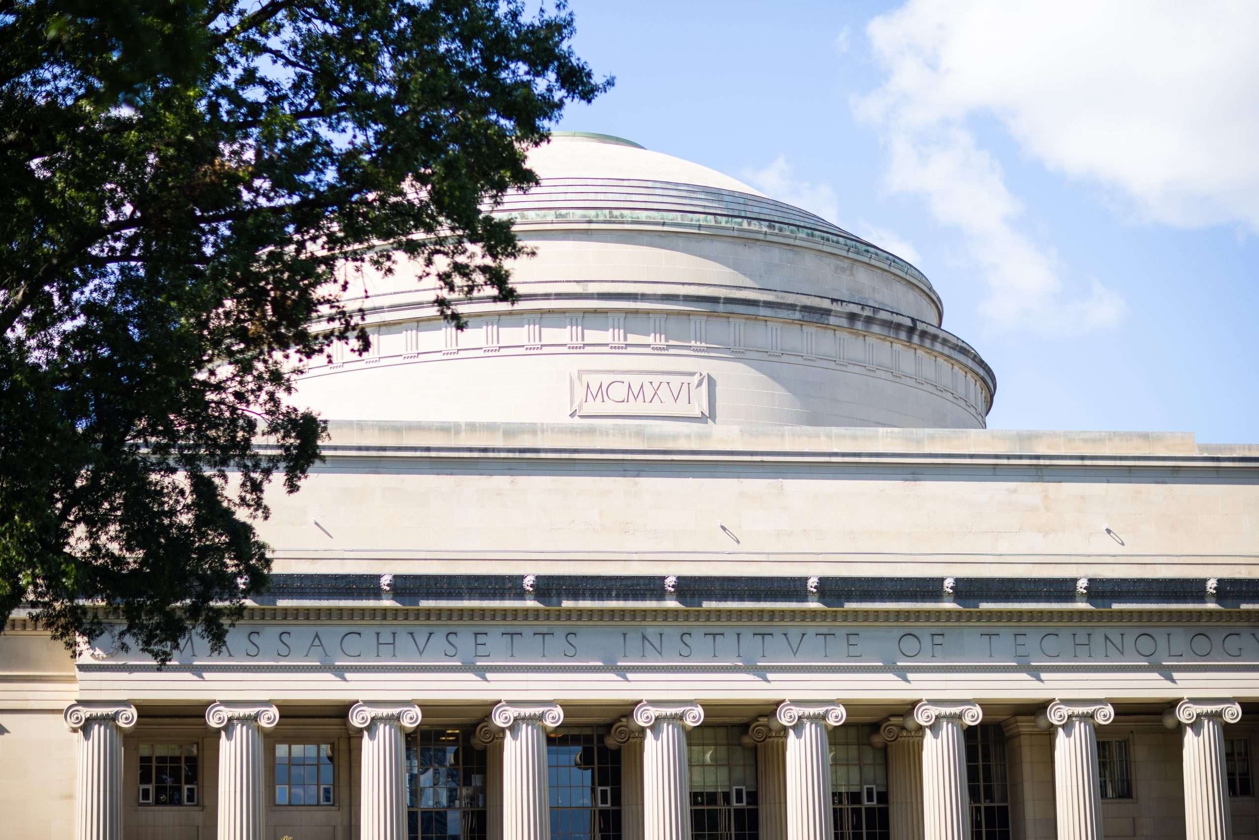 The top of the dome above a columned building at the Massachusetts Institute of Technology is featured.