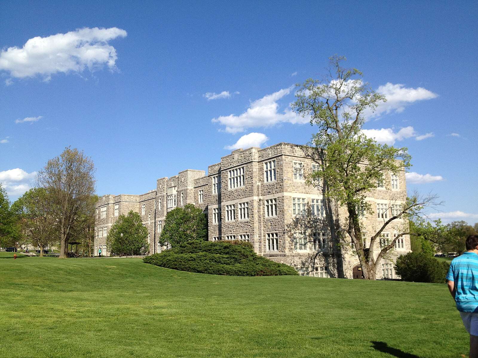 Patton Hall is featured beyond a lawn at Virginia Tech.