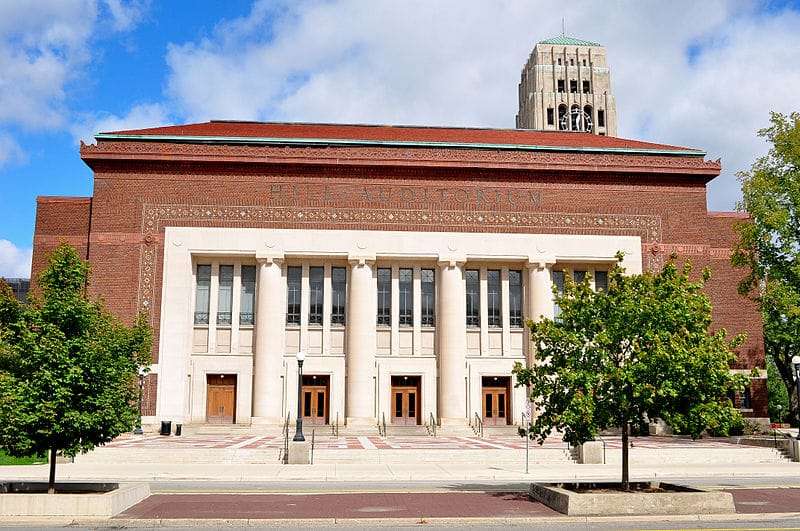A columned auditorium is featured from the outside at the University of Michigan.