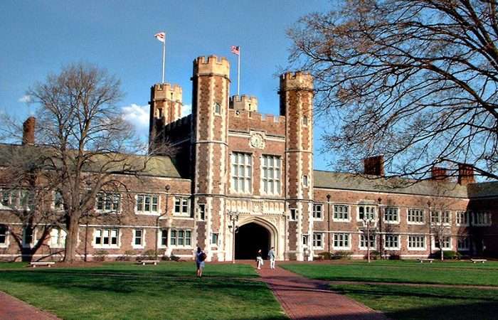 This is a Washington University in St. Louis building, with two flags flying overhead.